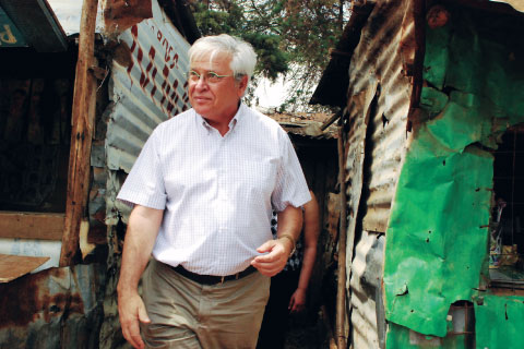 Joan Clos, executive director of UN-Habitat, visiting the Kibera slum in Nairobi, Kenya