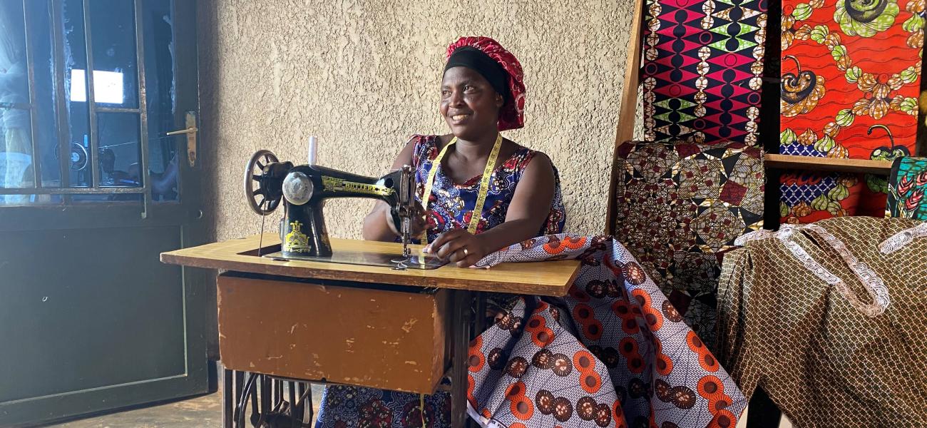 Chantal sits at her sewing machine.