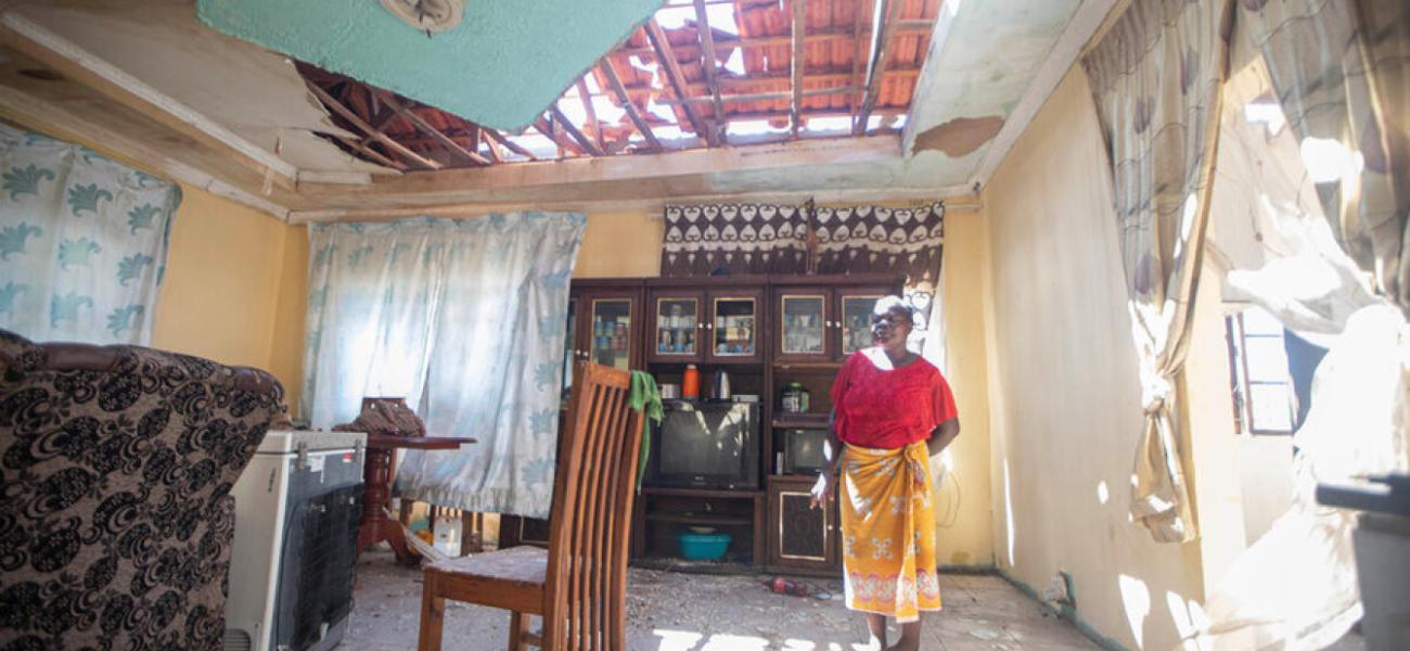 A woman assesses damage to her home caused by tropical storm Filipo in Morrumbene district, Inhambane province, Mozambique.