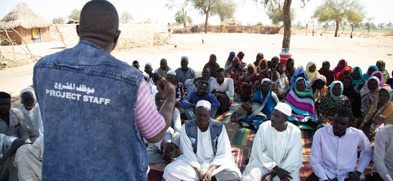 CRS staff addressing the community in Hashaba village, West Darfur, Sudan.