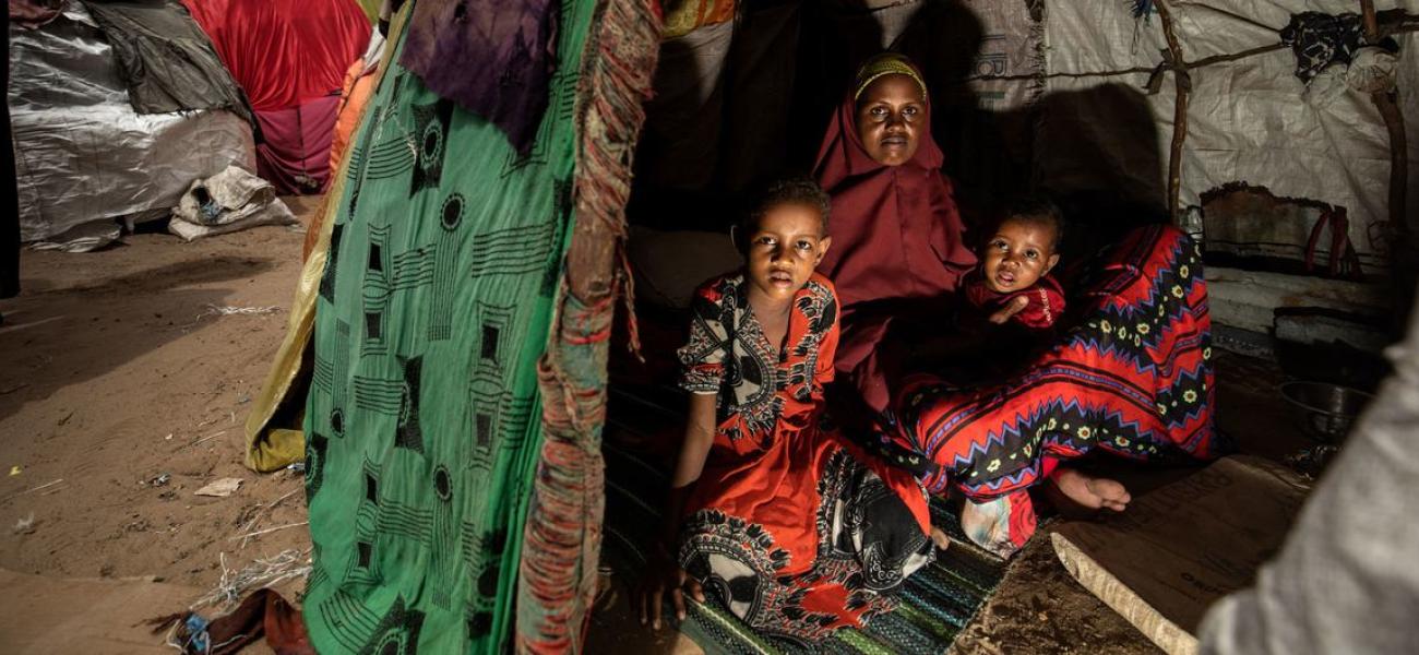 A mother and her children shelter at a camp for internally displaced people in Mogadishu, Somalia. (file)