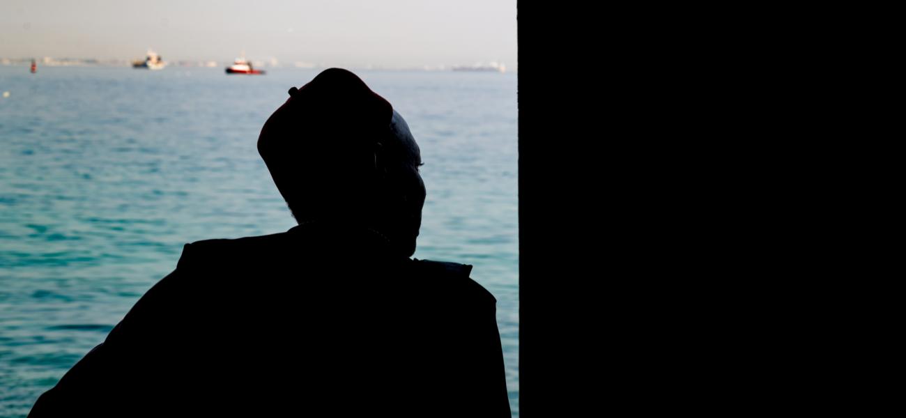 A man looks out to sea from the Door of No Return on Gorée Island, Senegal—a solemn memorial to the millions of Africans taken from their homeland during the transatlantic slave trade. The island stands today as a symbol of remembrance and resilience.