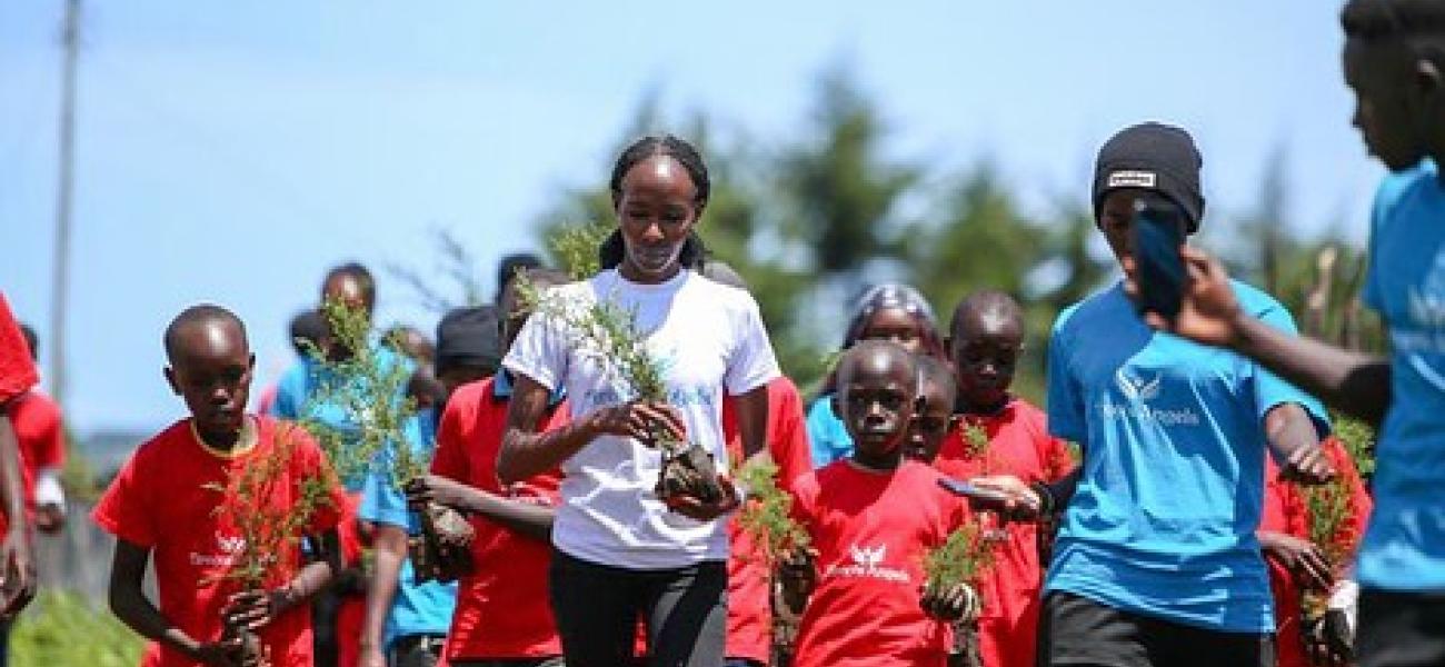 Viola Cheptoo (center) - fighting GBV and climate change.