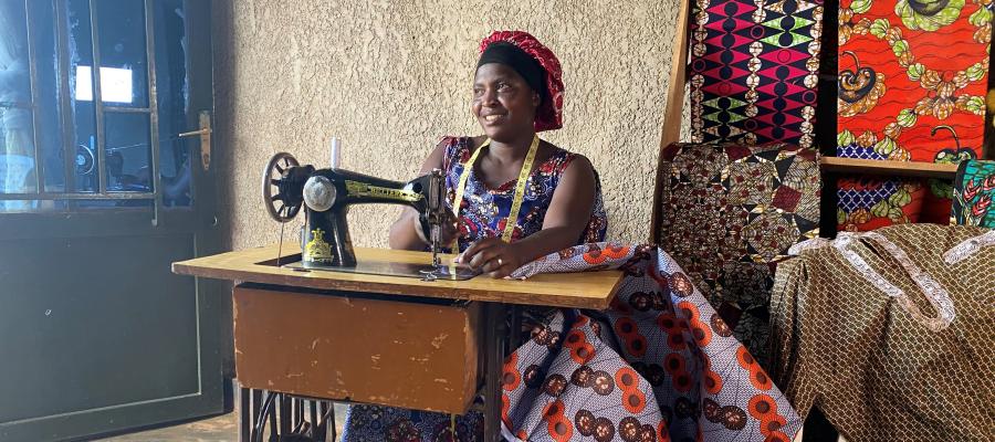 Chantal sits at her sewing machine.