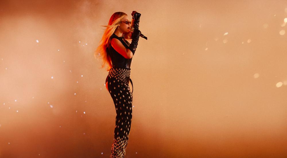 Beyoncé wears a custom Tongoro Couture Cowboy Chaps adorned with 444 golden cowries and 44 crystals for the opening night of the Cowboy Carter tour in Houston, Texas.