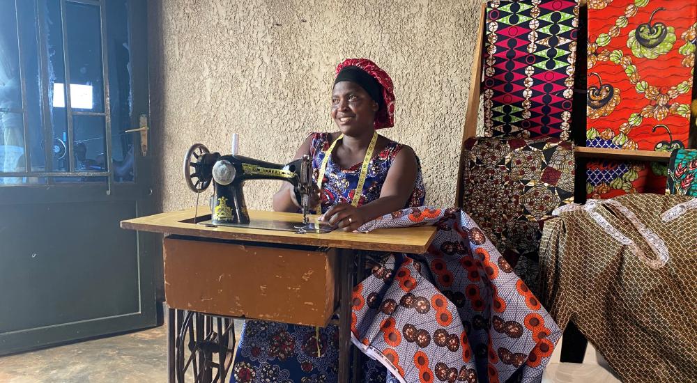 Chantal sits at her sewing machine.