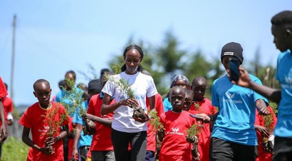 Viola Cheptoo (center) - fighting GBV and climate change.