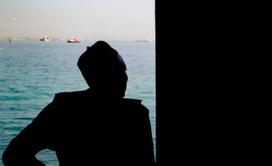 A man looks out to sea from the Door of No Return on Gorée Island, Senegal—a solemn memorial to the millions of Africans taken from their homeland during the transatlantic slave trade. The island stands today as a symbol of remembrance and resilience.