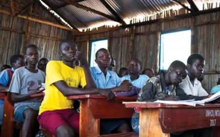 Refugee students in a classroom in Uganda. Photo: UN Photo/Mark Garten