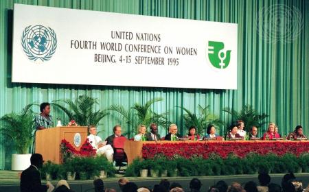 A view of the head table during the opening session of the Fourth World Conference on Women in Beijing. Gertrude Mongella (left, standing at the podium), Secretary-General of the Conference, delivers her address.