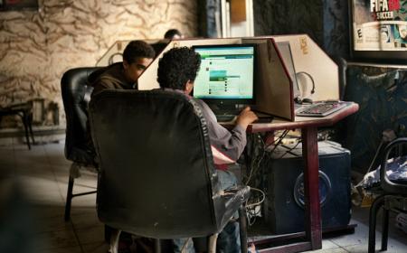 Young men using computers in a cybercafe in Cairo, Egypt, where Khaled (Jaled) Said, a 28-year-old blogger, was arrested and beaten to death by police in 2010. Later, 400,000 people joined the ‘We’re all Khaled Said’ campaign on Facebook is considered one