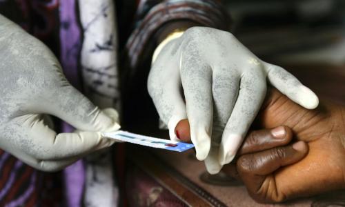 A woman has her blood taken for a test at a clinic in Freetown, Sierra Leone. Photo: Panos/ Giacomo Pirozzi