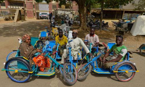 Survivors of polio in Kano State, Nigeria, sit on tricycles specially designed for people with disabilities.