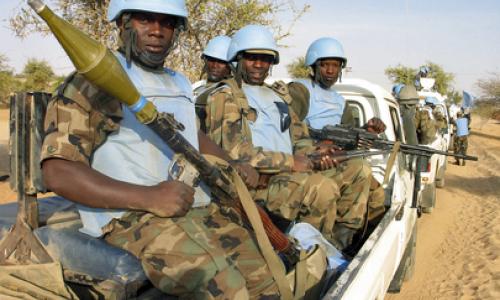 Soldiers from the joint African Union - United Nations Mission in Darfur (UNAMID) peacekeeping force guard a supply convoy. Photo: UN Photo/David Manyua
