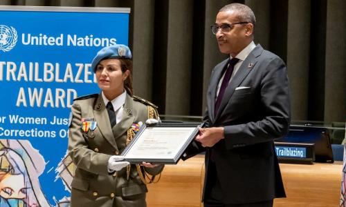 Major Ahlem Douzi is presented with the United Nations Trailblazer Award by Chef de Cabinet Courtenay Rattray at a special ceremony.