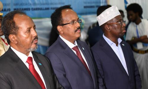 Former Presidents of Somalia, Hassan Sheikh Mohamud (left) and Sharif Sheikh Ahmed (right) stand side by side with the new president of Somalia Mohamed Abdullahi Farmaajo at the inauguration ceremony in Mogadishu on February 22, 2017.
