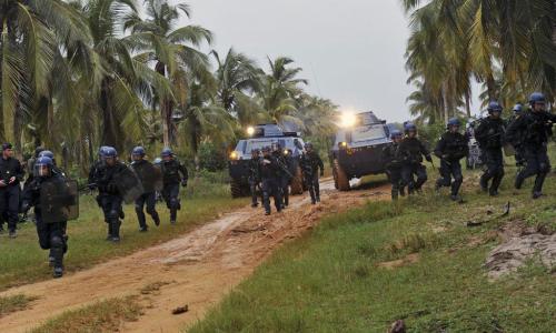 French forces from Opération Licorne (Operation Unicorn) and Jordanian Formed Police Units from the United Nations Operation in Côte d'Ivoire (UNOCI) conduct crowd control exercises near Grand Bassam, Côte d'Ivoire. Opération Licorne works in support of U