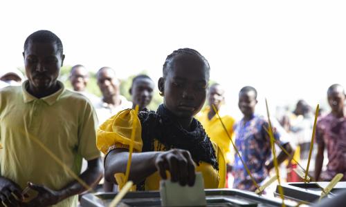 A voter casts her vote.