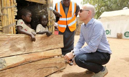 UN Assistant High Commissioner for Protection Volker Türk talks to displaced Nigerian children in Malkohi host community, Yola, Nigeria.