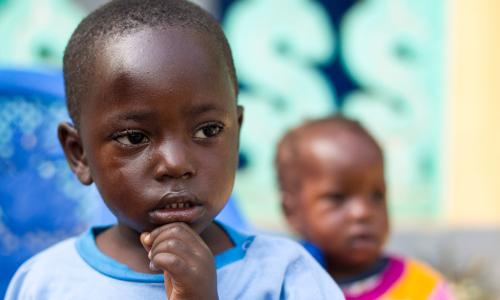 A child who lost members of his family to the Ebola virus plays at the Alliance for International Medical Action (ALIMA) Child Care Centre in Nzérékoré, Guinea. UN Photo/Martine Perret