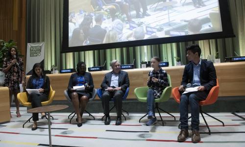 Secretary-General António Guterres, Greta Thunberg and others on stage at the Youth Climate Summit.