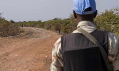 In this file photograph, an UNMISS peacekeeper patrols a road near Bentiu, Unity state, South Sudan. Patrols such as these serve to show a presence and to provide protection in the area. Photo: UNMISS