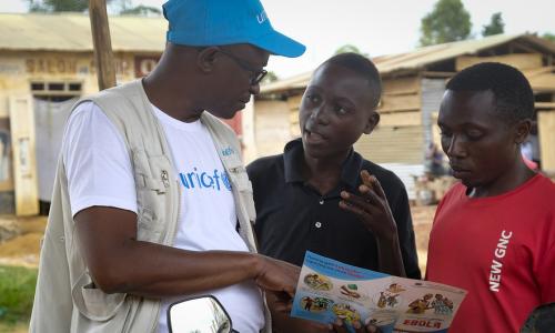 Photo Credits:Thomas Nybo. On 12 September 2018 in Beni, a UNICEF staff member discusses the best way to protect yourself against Ebola in a conversation with young people living in Beni, Democratic Republic of Congo, after a recent Ebola outbreak.