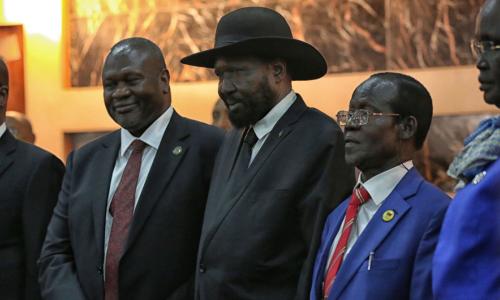 Salva Kiir, President of South Sudan, (centre right) shakes hands with Riek Machar, who was sworn in as First Vice President of the new Transitional Government of National Unity on 22 February 2020.