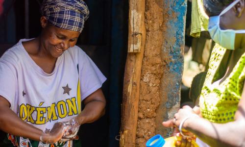 In the Kibera slum in Nairobi, Kenya, residents are provided with soap and water to wash their hands in order to help halt the spread of the coronavirus.