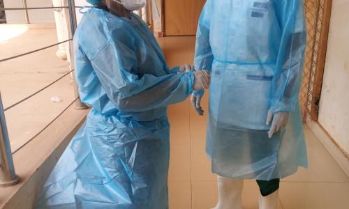 Dr. Babio (left) and Dr. Amoussouvi preparing for the visit of all hospitalized patients.
