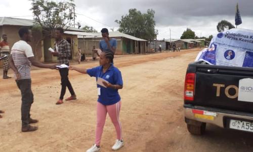 Social mobilisation team broadcasting messages from a van and giving out materials on COVID-19 prevention in Hararghe Ethiopia.