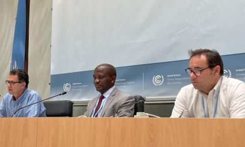 Mr. Ephraim Mwepya Shitima of Zambia, at center, between two other meeting participants.