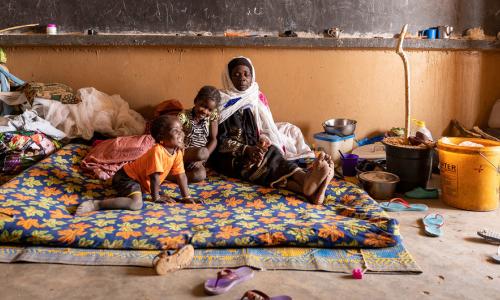 A displaced family from a village in Mali was relocated to a former school.