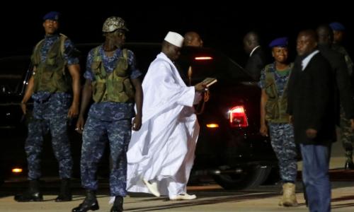 The Gambia’s former president Yahya Jammeh (in white) prepares to depart from Banjul airport to exile in Guinea Bissau on January 21, 2017. Photo: Reuters/Thierry Gouegnon