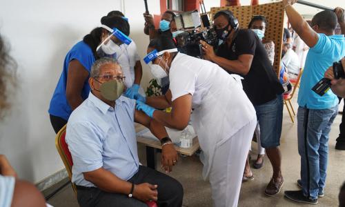 An image of An image of Wavel Ramkalawan, political leaders and health workers took the COVID-19