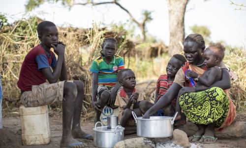 Sudanese refugee Amal Bakith cooks the first breakfast for her children a day after arriving in Ajuong Thok camp, South Sudan. During their long journey from South Kordofan, they had only rotten food to eat. Photo: UNHCR/Rocco Nur