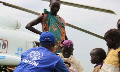This photo from November 2014 shows IOM providing transportation assistance in South Sudan, moving vulnerable refugees on a UNHCR helicopter. Photo: IOM