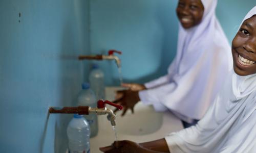 Photo: UNICEF/Kate Holt.  Students in Tanzania enjoy fresh water for drinking, washing and cooking.