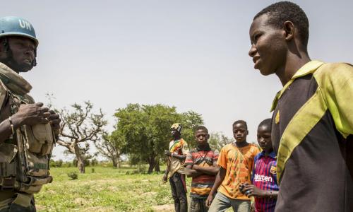 A United Nations peacekeeper in Mali interacts with children in the Mopti region of the West African country. (July 2019)