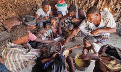 A family in Yemen sharing a meal.