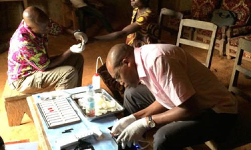 Testing of the mobile phone-based video microscope in Cameroon. Photo: NIAID.