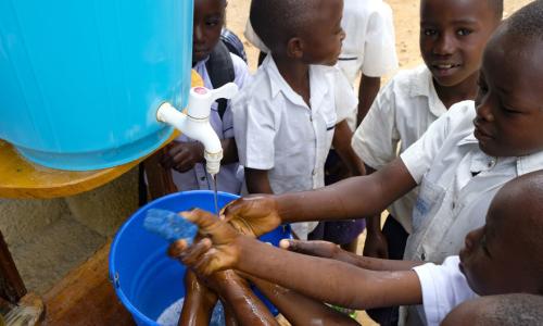 Learning that handwashing is among the best ways to protect yourself against Ebola, school children in Beni, DR Congo visit a UNICEF hand-washing station at their school. Photo Credits: UNICEF/Thomas Nybo