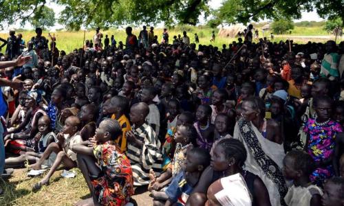 Aid workers register a community affected by hostilities in Jonglei State and explain the process to them which is important to provide food and other assistance. (August 2013) Credits: IOM