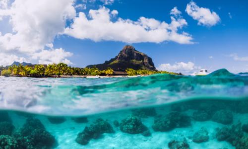 Blue ocean underwater and Le Morne mountain in Mauritius.