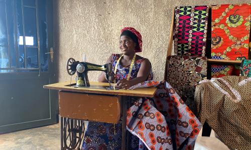 Chantal sits at her sewing machine.