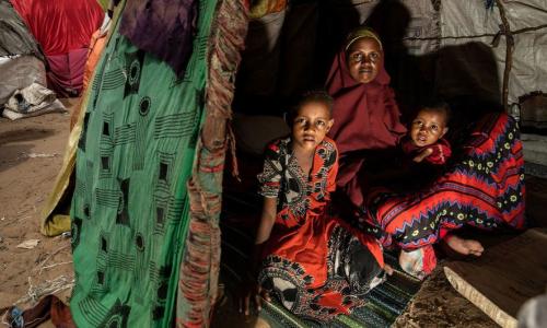 A mother and her children shelter at a camp for internally displaced people in Mogadishu, Somalia. (file)