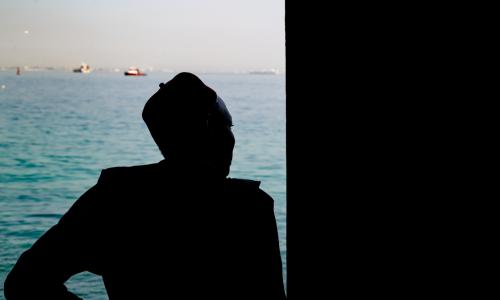 A man looks out to sea from the Door of No Return on Gorée Island, Senegal—a solemn memorial to the millions of Africans taken from their homeland during the transatlantic slave trade. The island stands today as a symbol of remembrance and resilience.
