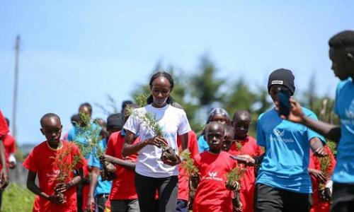 Viola Cheptoo (center) - fighting GBV and climate change.
