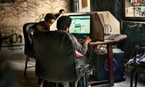 Young men using computers in a cybercafe in Cairo, Egypt, where Khaled (Jaled) Said, a 28-year-old blogger, was arrested and beaten to death by police in 2010. Later, 400,000 people joined the ‘We’re all Khaled Said’ campaign on Facebook is considered one