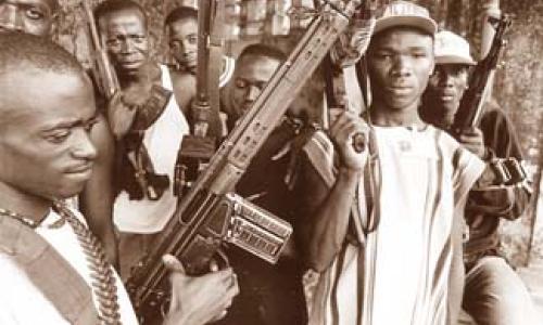 Rebels in Sierra Leone: small arms not only take many lives, but also exact a heavy toll on African societies and economies. Photo: ©Impact Visuals / Teun Voeten